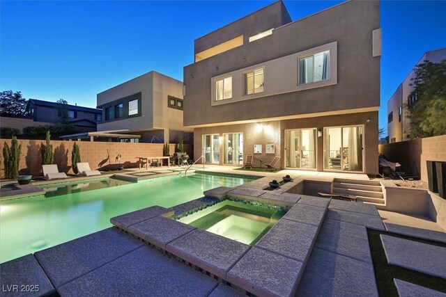 881 Barrhead Ave, Henderson, NV 89012 - rear view of property with an in-ground hot tub, a patio area, a fenced backyard, and stucco siding