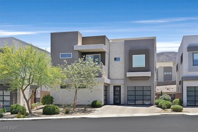 881 Barrhead Ave, Henderson, NV 89012 - contemporary house with driveway, stucco siding, and an attached garage