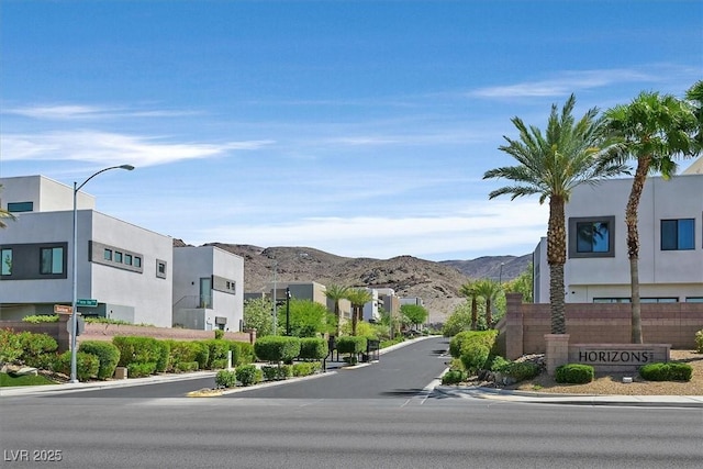 881 Barrhead Ave, Henderson, NV 89012 - view of asphalt road featuring curbs, street lighting, a residential view, and a mountain view