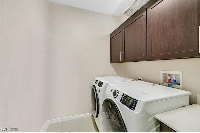 881 Barrhead Ave, Henderson, NV 89012 - laundry room with cabinet space, separate washer and dryer, baseboards, and light tile patterned floors