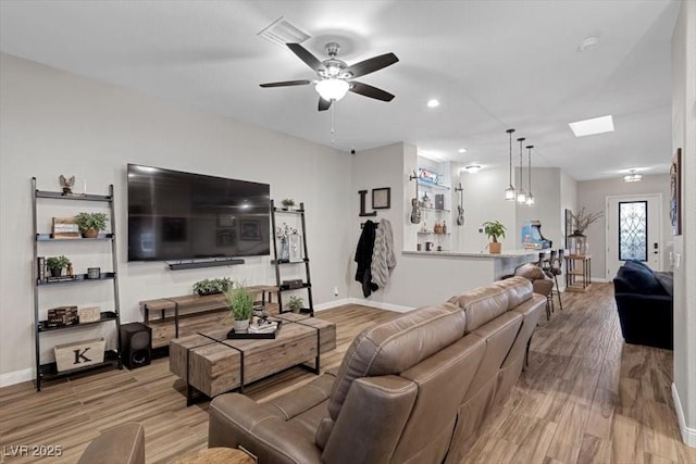 219 Windsong Dr, Henderson, NV 89074 - living room featuring baseboards, light wood-style flooring, a ceiling fan, and recessed lighting