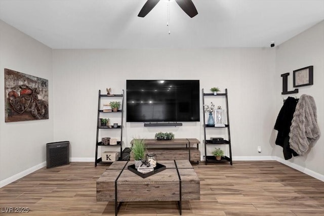 219 Windsong Dr, Henderson, NV 89074 - living room with wood finished floors, a ceiling fan, and baseboards