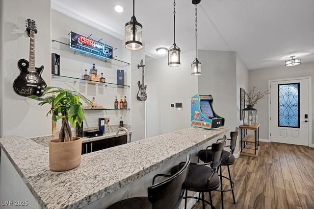 219 Windsong Dr, Henderson, NV 89074 - indoor wet bar with wood finished floors and pendant lighting