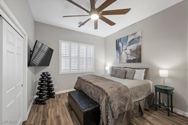 219 Windsong Dr, Henderson, NV 89074 - bedroom with baseboards, wood finished floors, and a ceiling fan