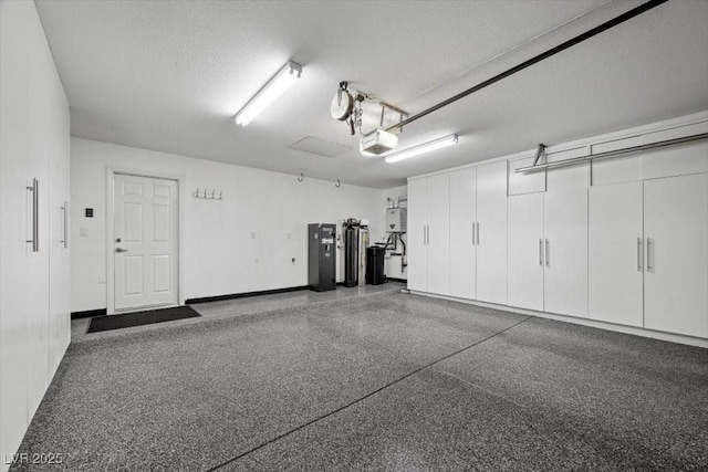 219 Windsong Dr, Henderson, NV 89074 - garage with a garage door opener and baseboards