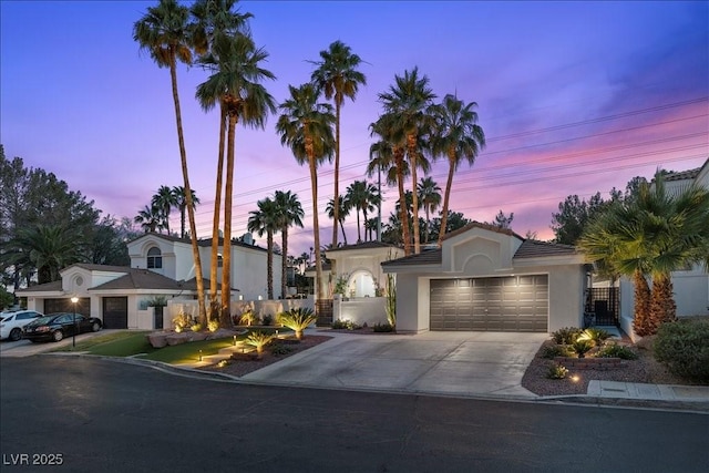 219 Windsong Dr, Henderson, NV 89074 - view of front of property featuring concrete driveway, an attached garage, and stucco siding