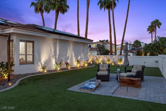 219 Windsong Dr, Henderson, NV 89074 - yard at dusk featuring a patio area