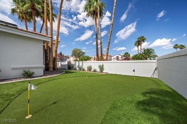 219 Windsong Dr, Henderson, NV 89074 - fenced backyard featuring a putting green