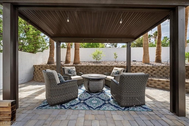 219 Windsong Dr, Henderson, NV 89074 - fenced backyard with a patio and outdoor lounge area