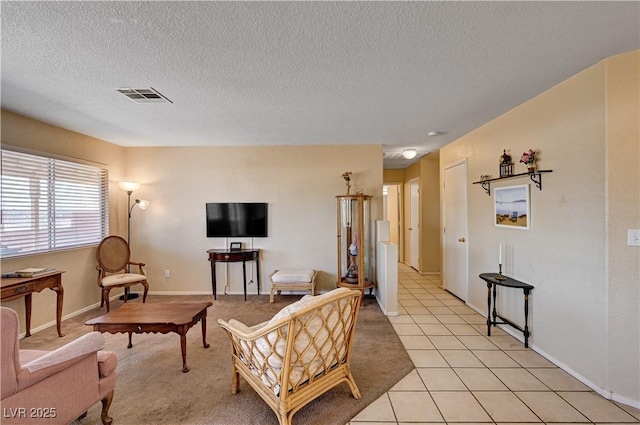 1902 Panther Pl, North Las Vegas, NV 89031 - living room with a textured ceiling, light tile patterned floors, and baseboards