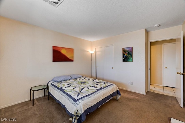 1902 Panther Pl, North Las Vegas, NV 89031 - carpeted bedroom with baseboards, a textured ceiling, and a closet