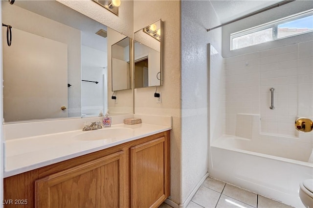 1902 Panther Pl, North Las Vegas, NV 89031 - full bath featuring vanity, tile patterned flooring, tub / shower combination, a textured wall, and toilet