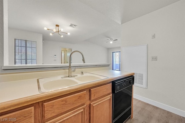 2633 S Durango Dr Unit 204, Las Vegas, NV 89117 - kitchen featuring dishwasher, a sink, baseboards, light wood-style flooring, and brown cabinets