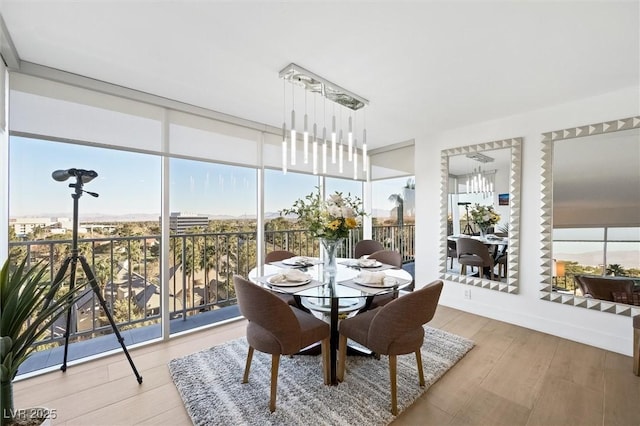 3111 Bel Air Dr Unit 7F, Las Vegas, NV 89109 - sunroom featuring a chandelier and plenty of natural light