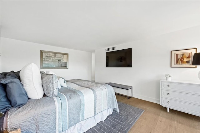 3111 Bel Air Dr Unit 7F, Las Vegas, NV 89109 - bedroom featuring wood finished floors and baseboards