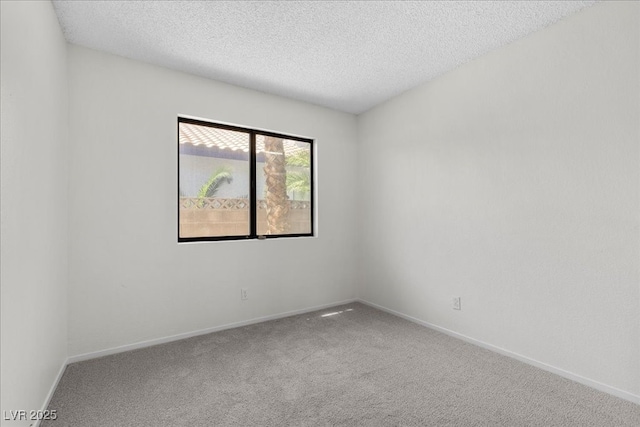 6997 Ray Charles Ln, Las Vegas, NV 89119 - spare room with carpet, a textured ceiling, and baseboards