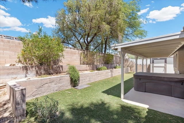 6997 Ray Charles Ln, Las Vegas, NV 89119 - view of yard featuring a hot tub and a patio area