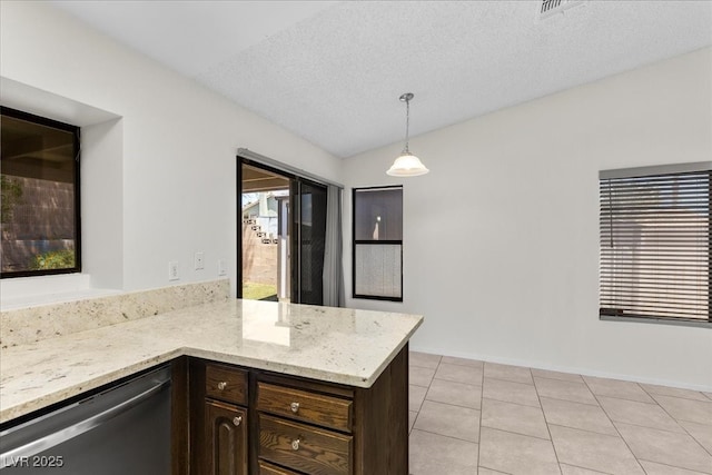 6997 Ray Charles Ln, Las Vegas, NV 89119 - kitchen featuring dishwasher, dark brown cabinets, light tile patterned flooring, light stone counters, and pendant lighting