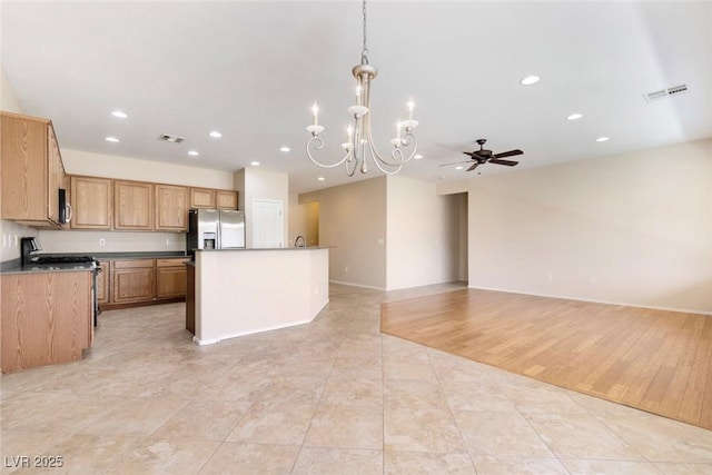 2538 Capella Star St, Henderson, NV 89044 - kitchen featuring stainless steel appliances, a chandelier, recessed lighting, open floor plan, and a center island with sink