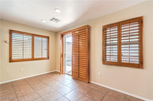 9073 Spoonbill Ridge Pl, Las Vegas, NV 89143 - unfurnished bedroom with access to outside, tile patterned flooring, baseboards, and recessed lighting