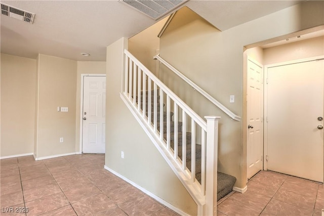 9073 Spoonbill Ridge Pl, Las Vegas, NV 89143 - stairway featuring tile patterned floors and baseboards
