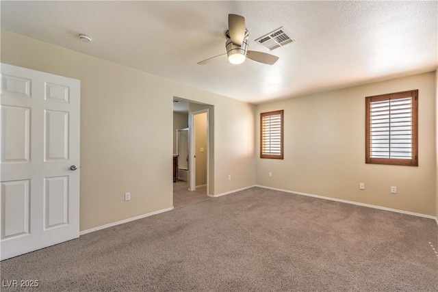 9073 Spoonbill Ridge Pl, Las Vegas, NV 89143 - unfurnished bedroom featuring carpet, baseboards, ceiling fan, and connected bathroom