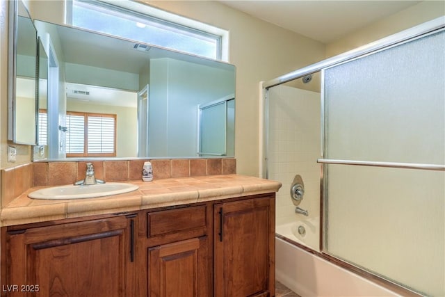 9073 Spoonbill Ridge Pl, Las Vegas, NV 89143 - bathroom with healthy amount of natural light, enclosed tub / shower combo, and vanity