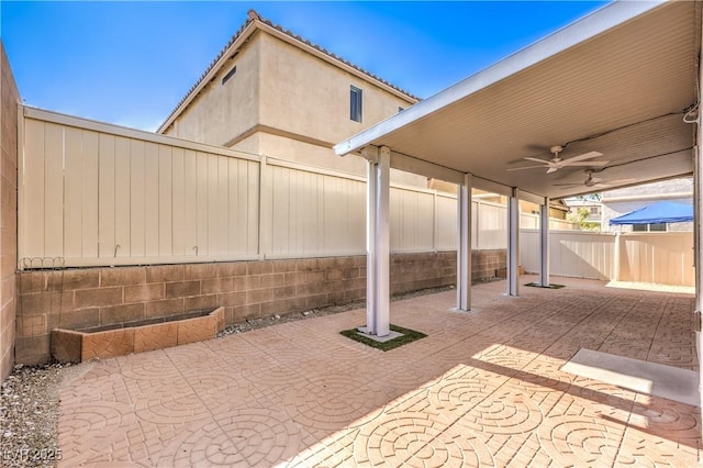 9073 Spoonbill Ridge Pl, Las Vegas, NV 89143 - fenced backyard with a patio area and ceiling fan