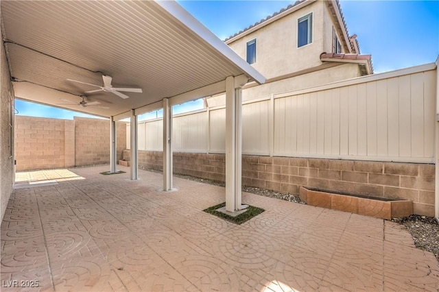 9073 Spoonbill Ridge Pl, Las Vegas, NV 89143 - fenced backyard featuring ceiling fan and a patio area