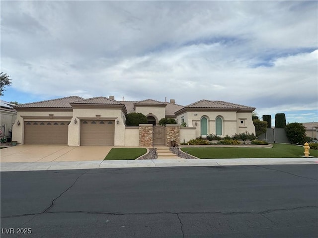 4208 Agosta Luna Pl, Las Vegas, NV 89135 - mediterranean / spanish house with stucco siding, an attached garage, driveway, and a tile roof