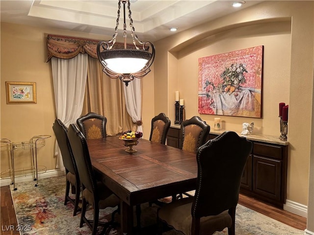 4208 Agosta Luna Pl, Las Vegas, NV 89135 - dining area with light wood-style flooring, baseboards, recessed lighting, and a raised ceiling