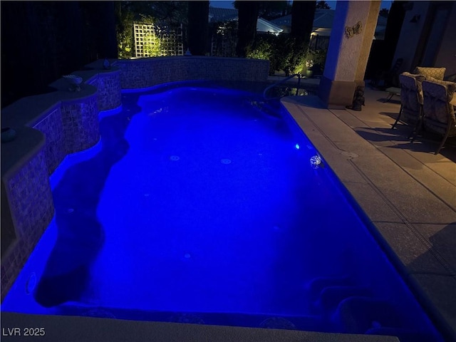 4208 Agosta Luna Pl, Las Vegas, NV 89135 - pool at twilight featuring an outdoor pool and a patio
