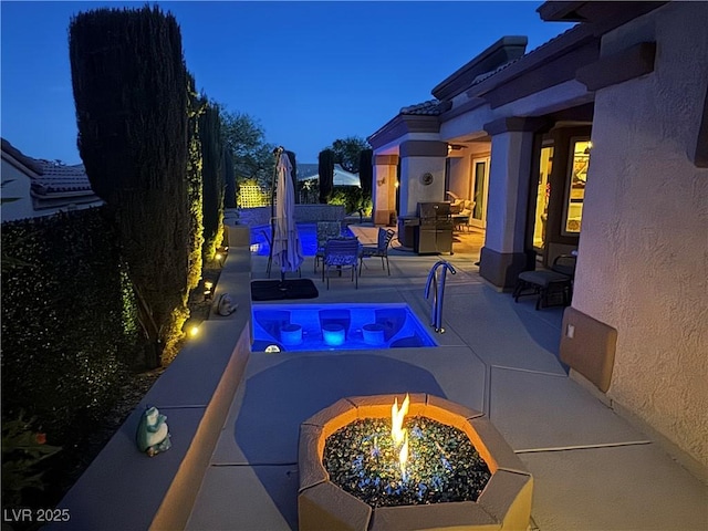 4208 Agosta Luna Pl, Las Vegas, NV 89135 - swimming pool with a fire pit, a patio area, and a fenced backyard