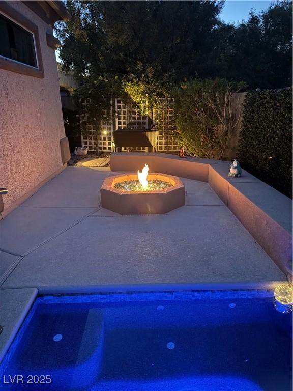 4208 Agosta Luna Pl, Las Vegas, NV 89135 - view of swimming pool with an outdoor fire pit and a patio