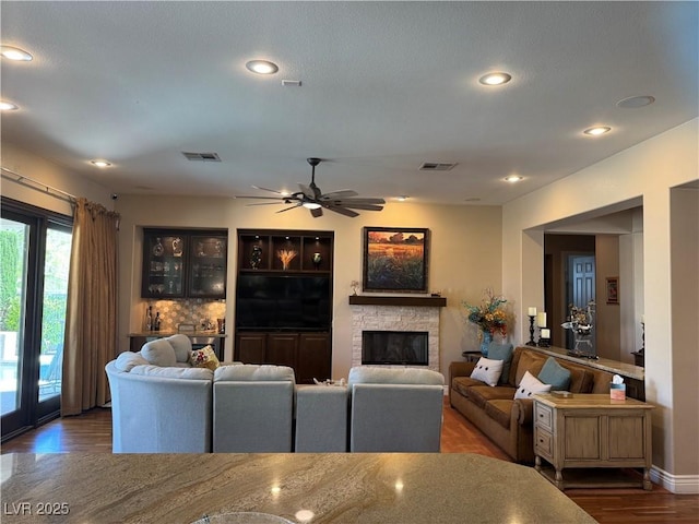 4208 Agosta Luna Pl, Las Vegas, NV 89135 - living area with wood finished floors, a fireplace, a ceiling fan, and recessed lighting