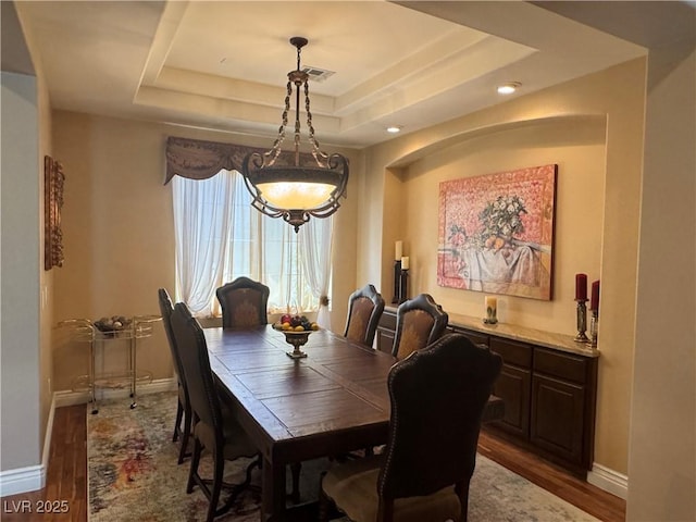 4208 Agosta Luna Pl, Las Vegas, NV 89135 - dining space featuring wood finished floors, baseboards, a tray ceiling, and recessed lighting