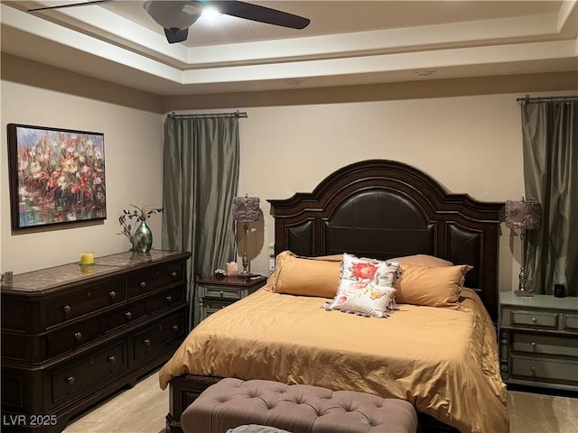 4208 Agosta Luna Pl, Las Vegas, NV 89135 - bedroom featuring light colored carpet, a raised ceiling, and a ceiling fan