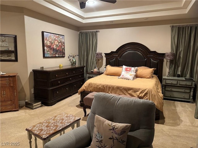 4208 Agosta Luna Pl, Las Vegas, NV 89135 - bedroom featuring light colored carpet, a raised ceiling, a ceiling fan, and baseboards