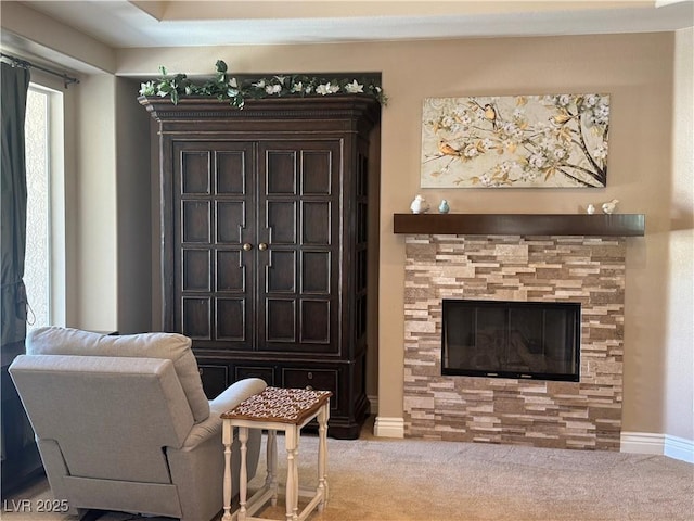 4208 Agosta Luna Pl, Las Vegas, NV 89135 - carpeted living room with a glass covered fireplace and baseboards