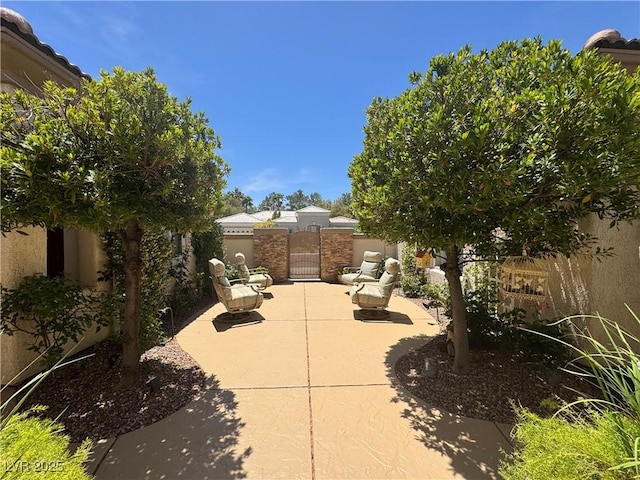 4208 Agosta Luna Pl, Las Vegas, NV 89135 - fenced backyard with a gate and a patio area