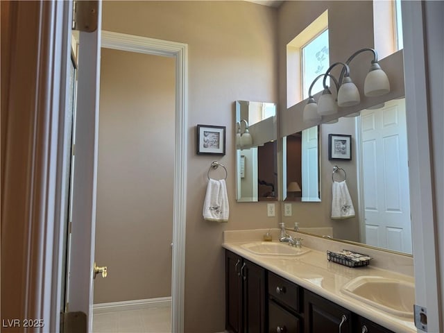 4208 Agosta Luna Pl, Las Vegas, NV 89135 - bathroom with double vanity and baseboards