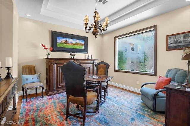 4208 Agosta Luna Pl, Las Vegas, NV 89135 - dining area featuring baseboards, a chandelier, wood finished floors, recessed lighting, and a raised ceiling