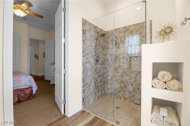 4208 Agosta Luna Pl, Las Vegas, NV 89135 - bathroom with a shower stall, baseboards, a ceiling fan, and wood finished floors