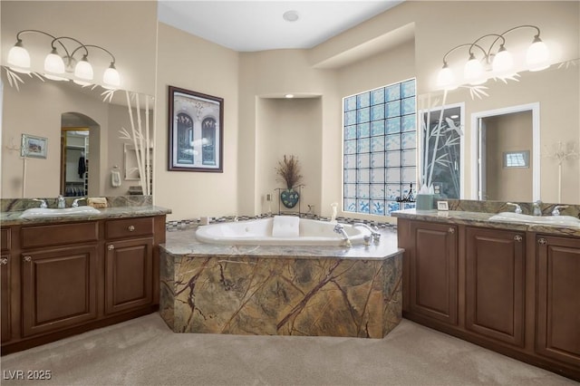 4208 Agosta Luna Pl, Las Vegas, NV 89135 - full bathroom with two vanities and a garden tub
