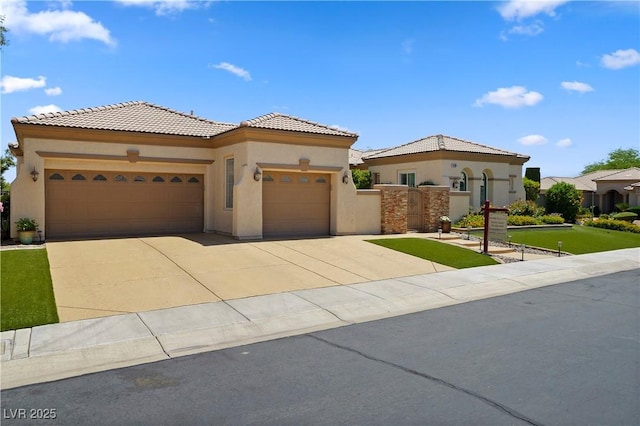 4208 Agosta Luna Pl, Las Vegas, NV 89135 - mediterranean / spanish-style house with stucco siding, a garage, concrete driveway, and a tiled roof