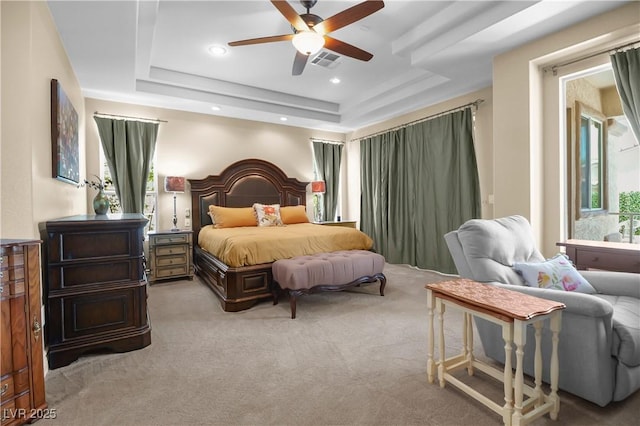 4208 Agosta Luna Pl, Las Vegas, NV 89135 - bedroom featuring a tray ceiling, light carpet, recessed lighting, and a ceiling fan
