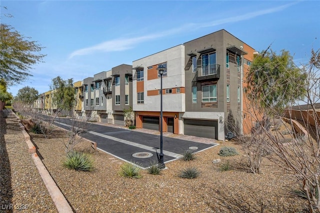 10985 Limeslice Ave Unit 2, Las Vegas, NV 89135 - view of building exterior featuring an attached garage and a residential view