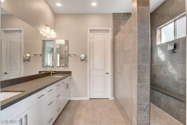 10985 Limeslice Ave Unit 2, Las Vegas, NV 89135 - bathroom with double vanity, a walk in shower, tile patterned floors, and recessed lighting