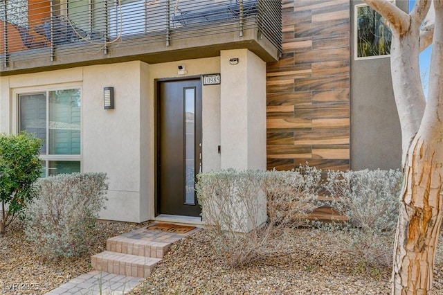10985 Limeslice Ave Unit 2, Las Vegas, NV 89135 - property entrance with a balcony and stucco siding