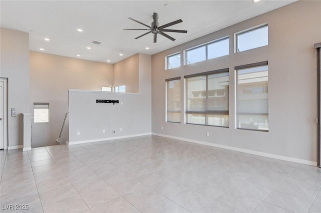 10985 Limeslice Ave Unit 2, Las Vegas, NV 89135 - unfurnished room with light tile patterned flooring, a ceiling fan, a high ceiling, and recessed lighting